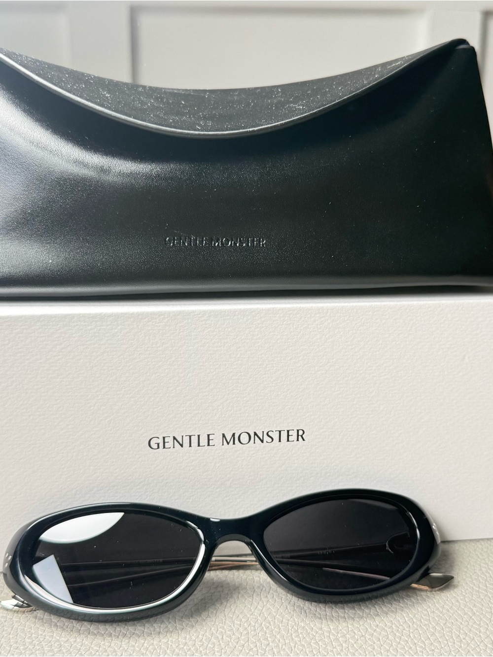 GENTLE MONSTER Black Oval Sunglasses with Matching Case